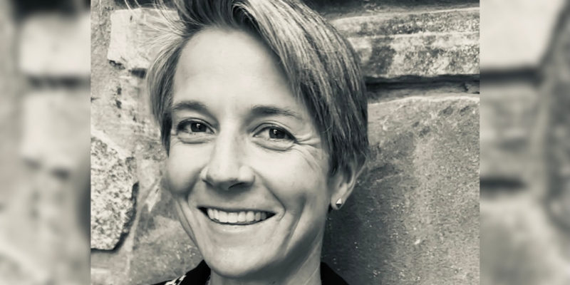 Headshot of Carey Candrian (with fair skin and short blonde hair)