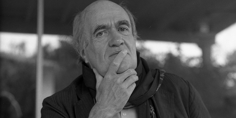 Black and white headshot of Colm Toibin (with fair skin and partially bald grey hair)