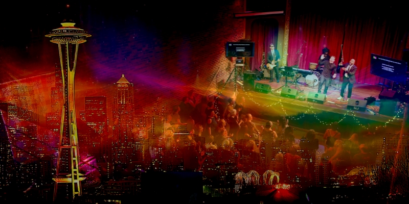 Banner graphic showing scenic view of the Space Needle, then fading into a man conducting a choir from the stage.