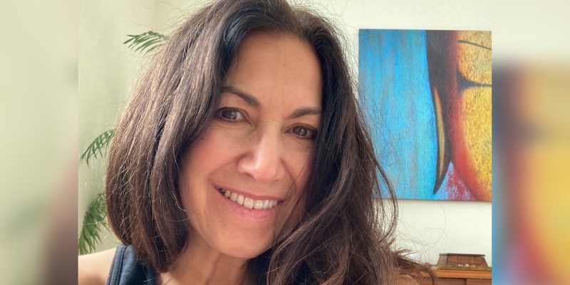 Headshot of Fran Gallo smiling (with fair skin and long brown hair)