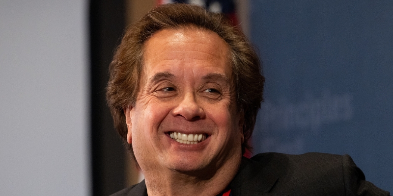 Headshot of George Conway (with light skin, short brown hair)