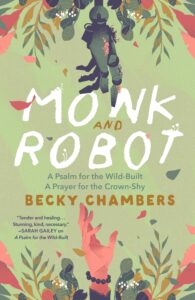 Book cover of "Monk and Robot: A Psalm for the Wild-Built and A Prayer for the Crown-Shy" by Becky Chambers, featuring a mechanical hand reaching for a human hand amidst pink and green leaves.