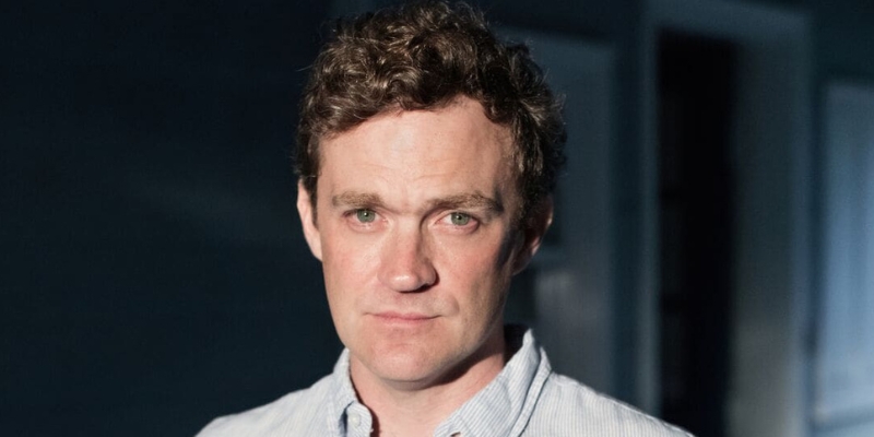 Headshot of Patrick Radden Keefe (with fair skin and short brown hair)