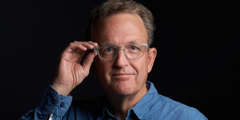 Headshot of Richard Rhodes (with fair skin, eyeglasses, and short grey hair)