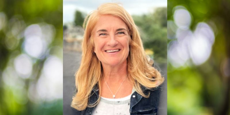 Headshot of Wendy Norman (with shoulder length blonde hair, fair skin)
