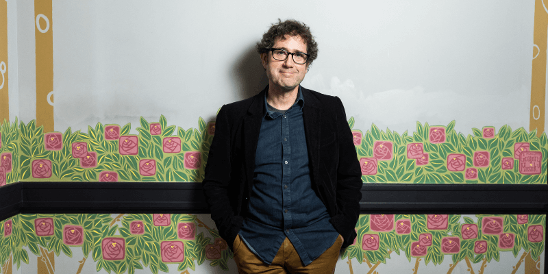 Wier Harman standing in the vestibule at Town Hall Seattle.